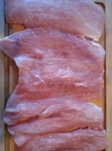 Make a cut length wise on pork at about 1/2 in from top. Continue to unroll meat with each length wise cut.